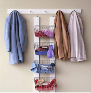A rack with baskets and hooks hanging on the wall.